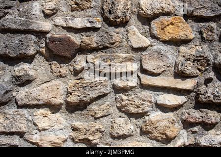 A close-up with an old stone wall, retro, vintage Stock Photo