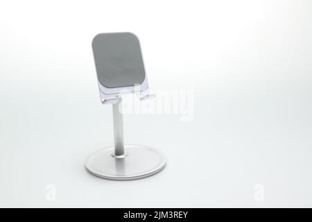 Smartphone stands on a white isolated background. Copy space Stock Photo