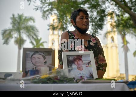 Merida, Yucatan, Mexico. 3rd Aug, 2022. August 3, 2022, Merida, Mexico: Maria mother of Jose Eduardo placed an altar in San Juan park, located in the center of the city of Mérida, to commemorate the death of her son. Maria and acquaintances prayed the rosary to Jose Eduardo, in the San Juan park located in the center of Merida, before leaving for the government palace. on August 3, 2022 in Merida, Mexico. (Photo by Mariana Gutiérrez/Eyepix Group (Credit Image: © Mariana Gutierrez/eyepix via ZUMA Press Wire) Stock Photo