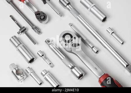 Open-end wrenches of various sizes with various hexagonal sockets. Composition on a white background Stock Photo
