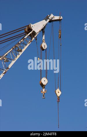 The block and tackle lifting cables of a crane at the Morehead City, USA Stock Photo