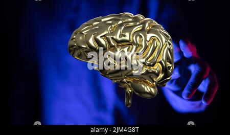 A male pointing at a brain - artificial intelligence concept Stock Photo