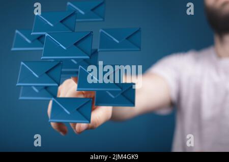 A person presenting the virtual projection of the email marketing concept with digital envelopes Stock Photo