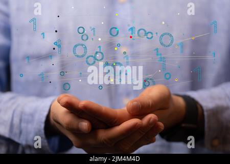 A 3D rendering of a binary code levitating in the air above a person's ...