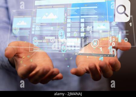 a shot of buisness diagrams flying over mans hands Stock Photo