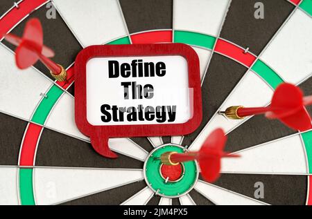 Business concept. On the darts are darts and a sign with the inscription - Define The Strategy Stock Photo