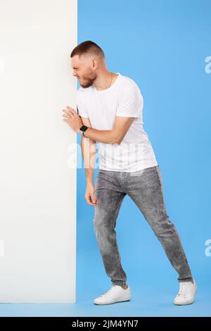 cheerful man holding board with empty copy space Stock Photo