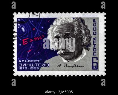 Albert Einstein, scientist, circa 1979. canceled vintage post stamp printed in USSR isolated on black background. Stock Photo