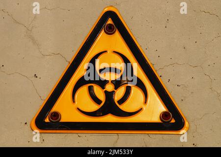Warning sign of biological danger in front of a laboratory at the Riedberg university campus, Frankfurt, Germany. ISO 7010, sign W009 Stock Photo