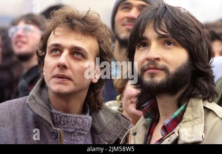 Bucharest, Romania, January 1990. Rally in the University Square following the Romanian Revolution of 1989. People would gather daily to protest the ex-communist officials that grabbed the power after the Revolution. Portrait of two young men attending the rally. Stock Photo