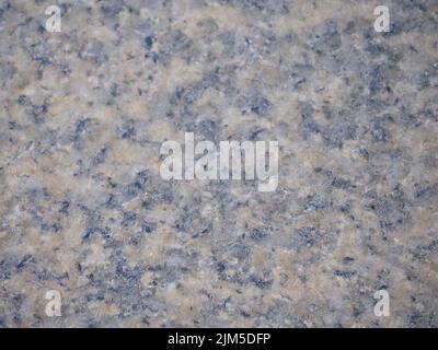 An antique texture on a historical granite block wall in Europe Stock Photo