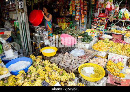Duong Dong, Phu Quoc Island, Vietnam - January 25, 2018: Vietnamese market vendor selling fresh fruit and vegetables at the Duong Dong Market located Stock Photo
