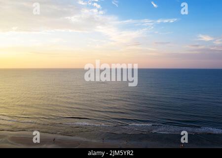 A aerial view of sunset at sea, waves and beach on Hilton Head Island, South Carolina Stock Photo