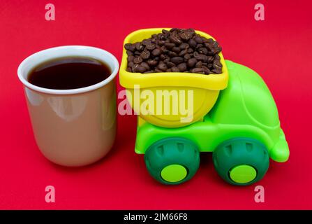 Truck transporting coffee beans and a cup of coffee. Coffee concept Stock Photo
