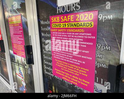 Augusta, Ga USA - 12 25 21: Vintage throw back Skateland Roller skate rink covid 19 sign on doors Stock Photo