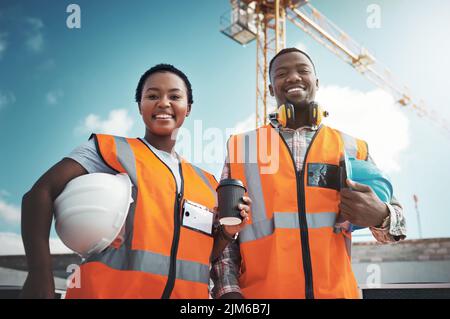 Prime property built on a foundation of equality. Portrait of a confident young man and woman working at a construction site. Stock Photo