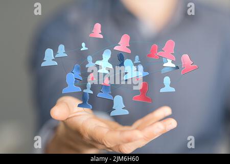 A blurred male holding teamwork network signs, the concept of a digital network on Stock Photo