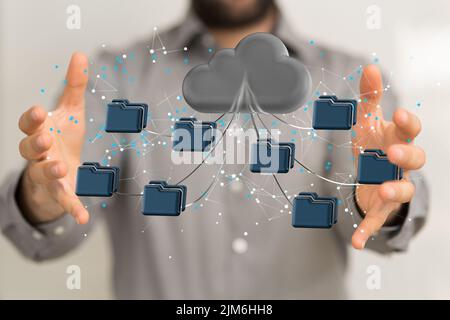 A businessman holding a digital render of a global cloud network of data Stock Photo