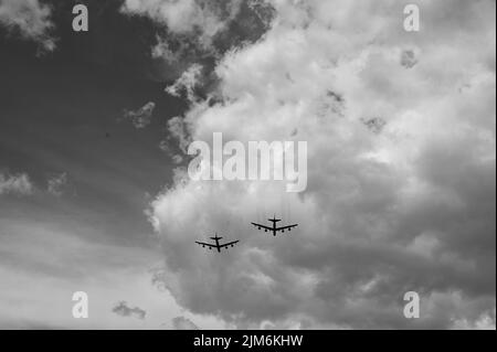 Two B-52H Stratofortress aircraft from Barksdale Air Force Base, Louisiana, fly over the interment ceremony for 6th Chief Master Sgt. of the Air Force James M. McCoy at the Omaha National Cemetery, Neb., July 29, 2022. McCoy passed away July 13, 2022, at the age of 91. (U.S. Air Force photo by Master Sgt. Jarad A. Denton)