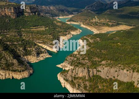 Aerial view of La Llosa del Cavall reservoir with little water during the summer drought of 2022 (Vall de Lord, Solsonès, Lleida, Catalonia, Spain) Stock Photo