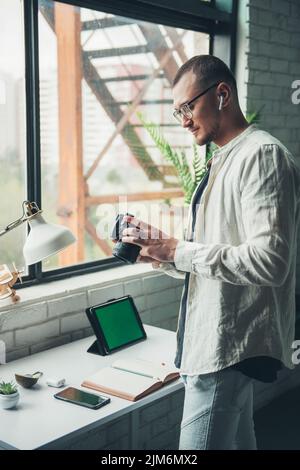 Photographer checking photos on digital camera to retouch on his digital gadgets. usiness, lifestyle concept. Creative concept. Modern business Stock Photo