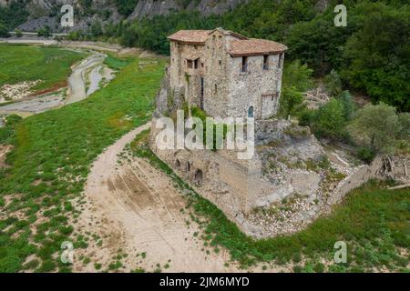 Aerial view of the area of Sant Salvador de la Vedella in the tail of the Baells reservoir completely dry during the drought of 2022 (Berguedà, Spain) Stock Photo