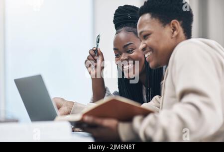 The learning doesnt stop during lockdown. a happy young couple working from home. Stock Photo
