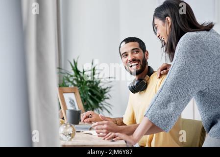 Home life, say hello to work life. a happy young couple working from home. Stock Photo