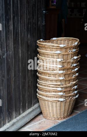 A vertical closeup of the stack of wicker baskets. Stock Photo