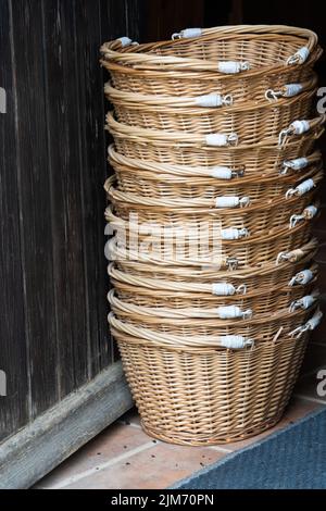 A vertical closeup of the stack of wicker baskets. Stock Photo