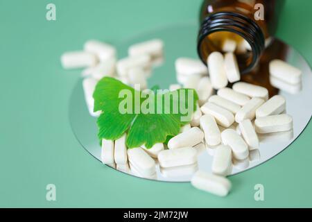 Ginkgo biloba pills.Preparations with ginkgo biloba extract.Alternative medicine and homeopathy.natural pharmacy. Stock Photo