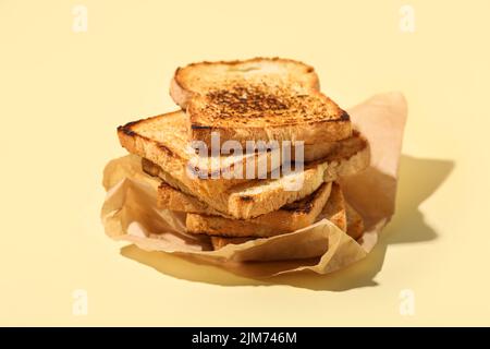 Stack of toasts on color background Stock Photo