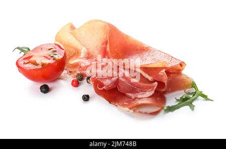 Delicious sliced jamon, spices and tomato on white background Stock Photo