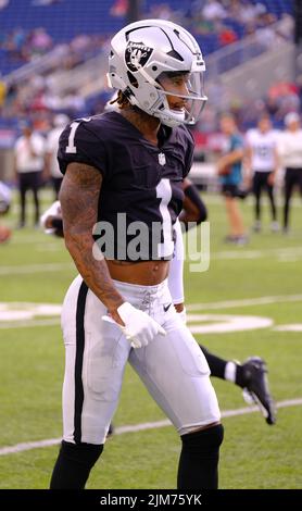 Las Vegas Raiders' Tyron Johnson (17) runs against the Los Angeles Chargers  during the first half of an NFL football game, Sunday, Jan. 9, 2022, in Las  Vegas. (AP Photo/Ellen Schmidt Stock