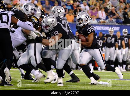 Inglewood, United States. 08th Dec, 2022. Las Vegas Raiders running back  Zamir White (35) and Los Angeles Rams cornerback Derion Kendrick (6)  exchange jerseys after an NFL game on Thursday, Dec. 8