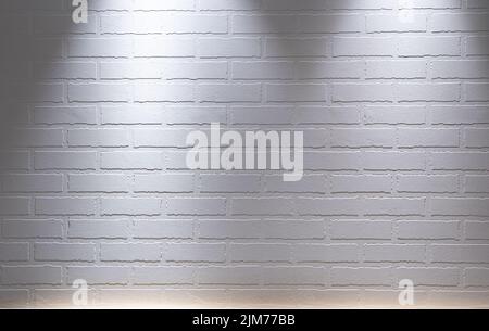 A white brick wall textured background with spotlight lighting Stock Photo