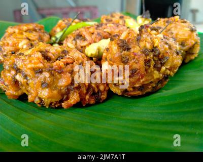 lento food from Indonesia. banana leaf background. close up shot outdoors. Stock Photo