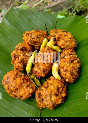 lento food from Indonesia. banana leaf background. close up shot outdoors. Stock Photo