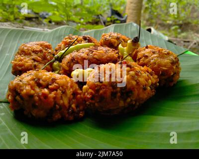 lento food from Indonesia. banana leaf background. close up shot outdoors. Stock Photo