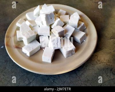 cheese peace in a plate on stone background Stock Photo