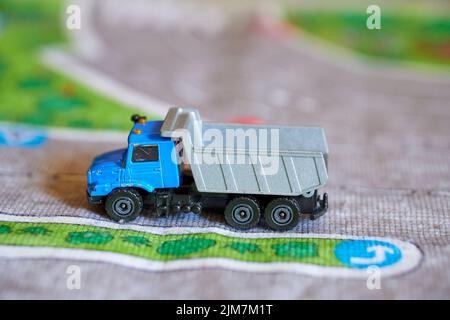 A closeup of a truck toy on a play road mat Stock Photo