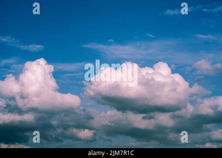 White whispy clouds and blue sky cloudscape. Fluffy white clouds and blue sky. Stock Photo