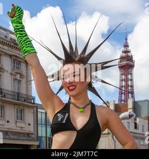 American model, SAG-AFTRA actress, wardrobe stylist, and TV host. fashion designer,  with Mohican style, dyed hair and colouring at the Punk Rebellion festival at The Winter Gardens. A protest against conventional attitudes and behaviour, a clash of anti-establishment cultures,  mohawks, safety pins and a load of attitude at the seaside town as punks attending the annual Rebellion rock music festival at the Winter Gardens come shoulder to shoulder with traditional holidaymakers. Stock Photo