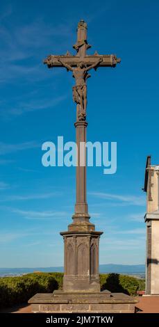 Lava stone cross in the village of Volvic in Auvergne (France) Stock Photo