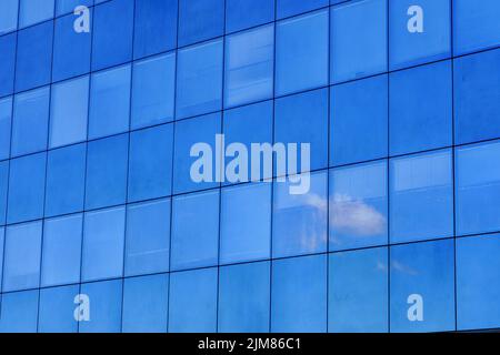 Perspective and underside angle view to textured background of modern glass building skyscrapers Stock Photo