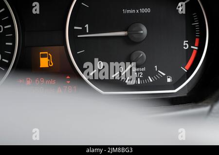 low on diesel fuel gauge in motor vehicle Stock Photo