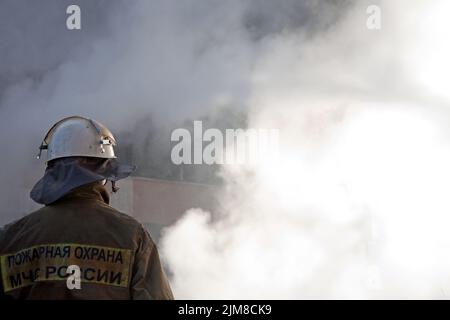 Firefighter on fire Stock Photo