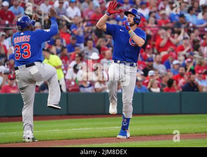 Chicago Cubs' Patrick Wisdom celebrates with third base coach Willie Harris  (33) after hitting a home run against the Arizona Diamondbacks during the  seventh inning during a baseball game Friday, July 16