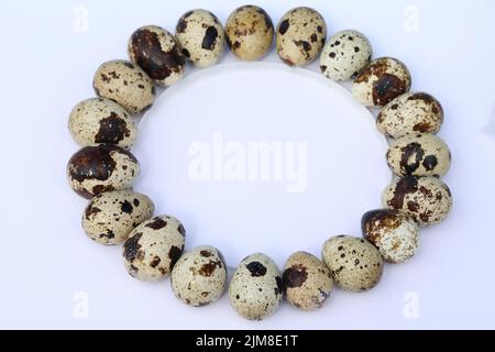 quail eggs on the white background with copy space Stock Photo