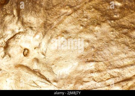 the texture of a golden stone. golden streaks. backgrounds and textures Stock Photo